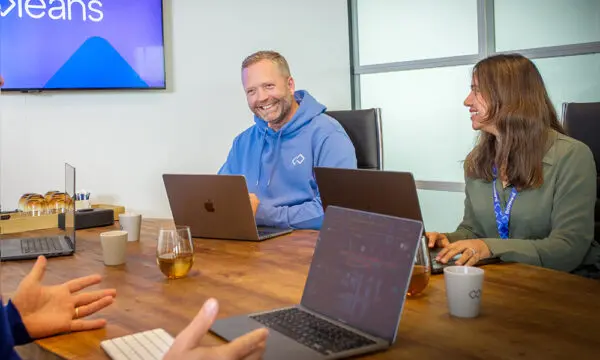 Booleans team members during a meeting