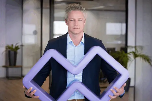 Booleans Founder and CEO, Rob Ojevaar holding the TrueLink