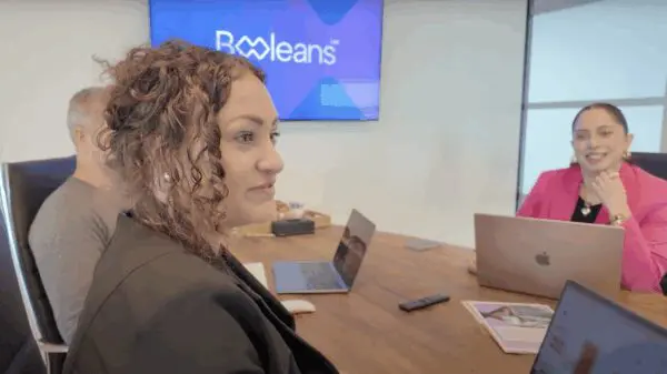 Booleans team members during a meeting