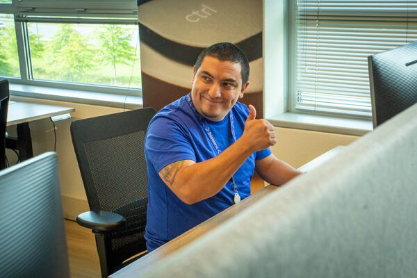 Principal Consultant of Booleans, Maurice Omar working at his desk